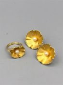 18ct gold earrings and ring in a floral design.