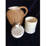 A cream stoneware jug, cream pot and cream lattice pot with bird lid