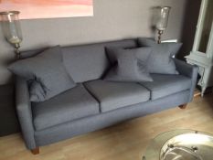 A three seat grey woollen sofa