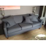 A three seat grey woollen sofa