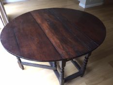 An 18th Century Drop leaf oak table