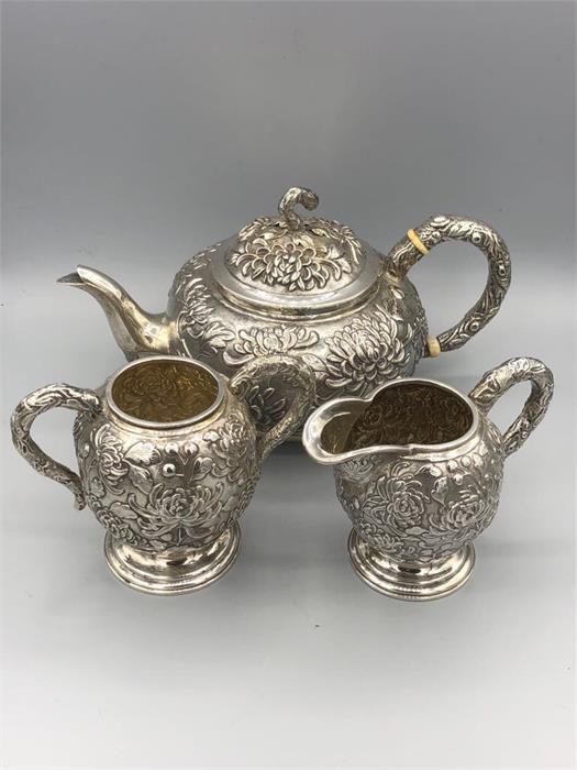 A Chinese silver tea set to include teapot, milk jug, sugar bowl and tray. - Image 3 of 10