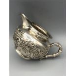 A silver milk jug