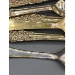 Silver cake forks and teaspoons with floral designed handle