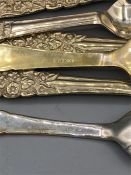 Silver cake forks and teaspoons with floral designed handle