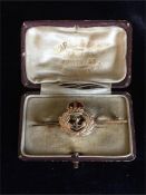 A 15ct gold Naval sweetheart brooch with enamel and a 9ct gold clip