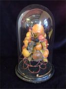 A Victorian glass dome with wax fruit display