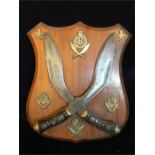 A Wooden Shield with kukris