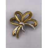 A 14ct gold brooch with diamond detail (7.9g)