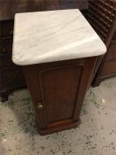 A pot cupboard with a marble top