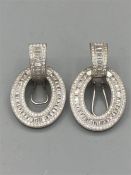 A Pair of Silver and CZ earrings
