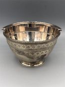 A silver bonbon dish with handle, marked 1874