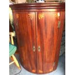 A corner cabinet with inlay decoration