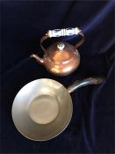 A small copper teapot and a saucepan with a horn handle