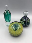 Three glass items to include two paperweights, one Mdina, and a scent bottle