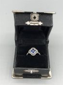 An 18ct White gold sapphire and diamond four leaf clover style ring 1.1ct's