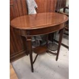 An oval mahogany incidental table