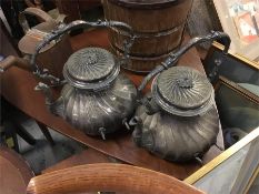 A pair of decorative metal tea pots
