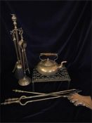 A selection of Brass items to include teapot, fireside companion set, fire irons and a trivet