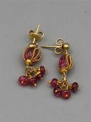 A pair of 18ct yellow gold pink sapphire earrings
