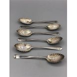 Six hallmarked silver teaspoons with shell bowls