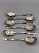 Six hallmarked silver teaspoons with shell bowls