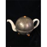 A 1920's Teapot and warmer