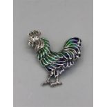 A Silver Plique A Jour Brooch in the form of a Rooster