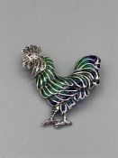 A Silver Plique A Jour Brooch in the form of a Rooster