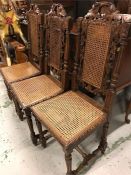 Six carved oak chairs with rattan seats and backs