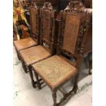 Six carved oak chairs with rattan seats and backs