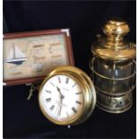A Nautical themed selection of wall clock, box framed knots, and a brass lamp.
