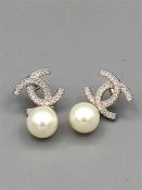 A Pair of Silver Chanel style earrings with pearl drops