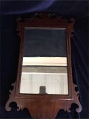 An Ornate mahogany mirror