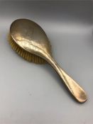 A silver, hallmarked dressing table brush