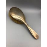 A silver, hallmarked dressing table brush