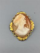 A Cameo brooch in a hallmarked 9ct gold setting