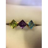 !8ct Yellow gold ring set with three precious stones Blue Topaz, Amethyst and Peridot