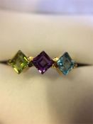 !8ct Yellow gold ring set with three precious stones Blue Topaz, Amethyst and Peridot