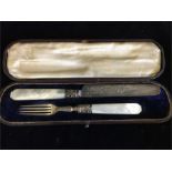 A Boxed set of silver knife and fork