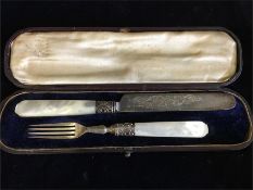 A Boxed set of silver knife and fork