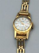 18ct yellow gold Mudu Swiss made watch and 9ct yellow gold strap 1936/37