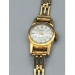 18ct yellow gold Mudu Swiss made watch and 9ct yellow gold strap 1936/37