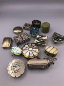 A selection of pill boxes, mainly silver