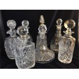 An Assortment of decanters, one with a silver neck