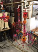 Two large colourful chandeliers and one small.