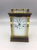 A L'Epée brass carriage clock with repeat, alarm and half hour strike, white enamel Roman dial
