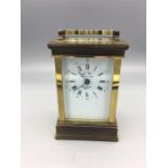 A L'Epée brass carriage clock with repeat, alarm and half hour strike, white enamel Roman dial