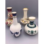 A selection of miniature decorative vases to include Royal Doulton, Worcester and Hadleys.