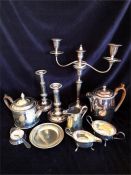 A Box of silver plated items to include a candlesticks, coffee pot etc